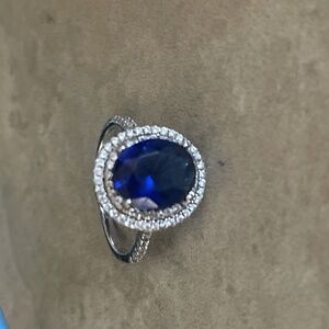 Sterling silver halo rings with a sapphire-style center stone